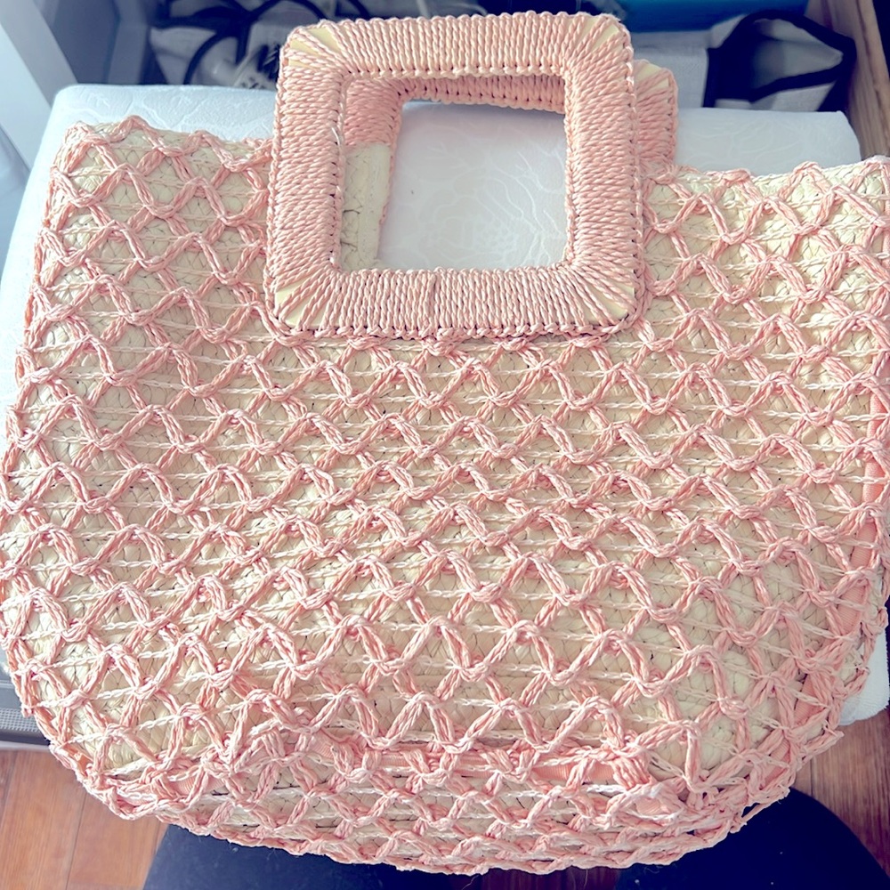 Woven straw beach handbag